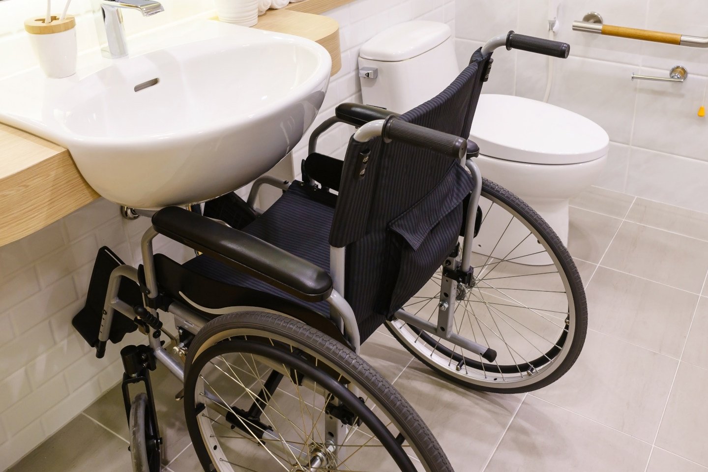 Interior of bathroom for the disabled or elderly people. Handrail for disabled and elderly people in the bathroom