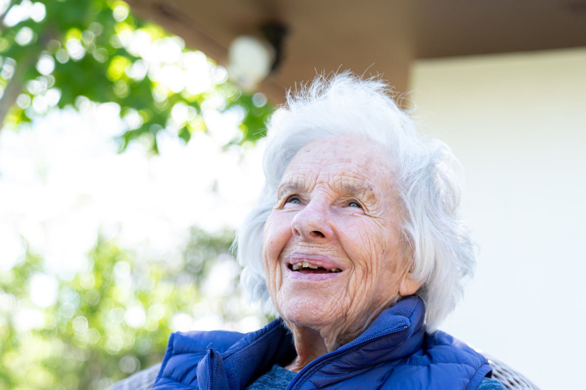 Beautiful 90 Plus Year-Old Elderly Senior Caucasian Woman Sitting Outdoors in Shade in the the Summer