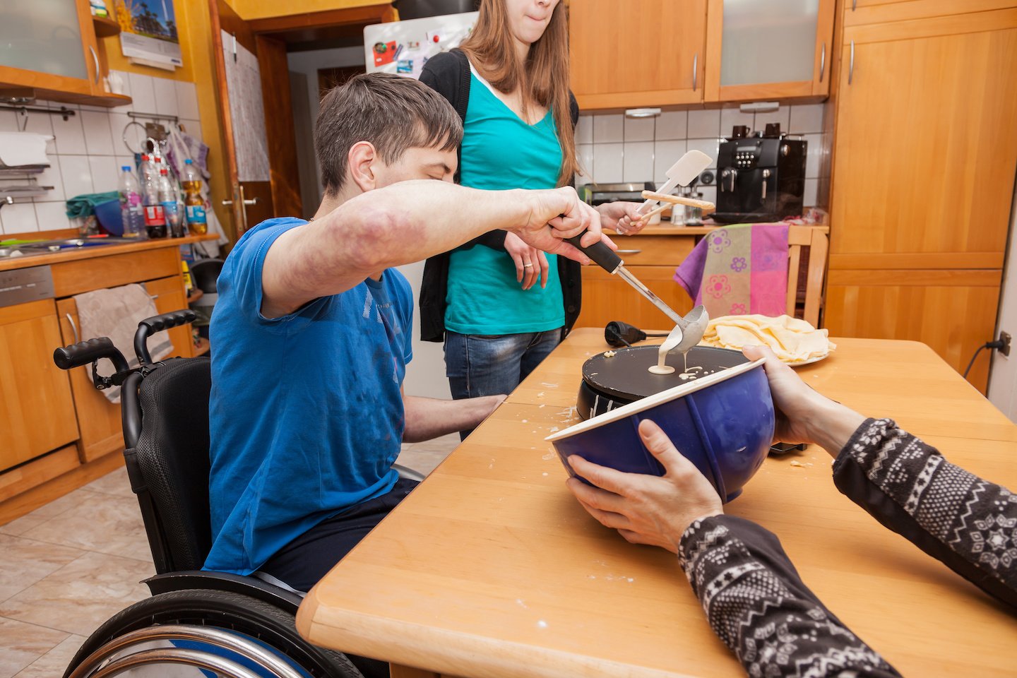 Family with handicapped son bakes waffles